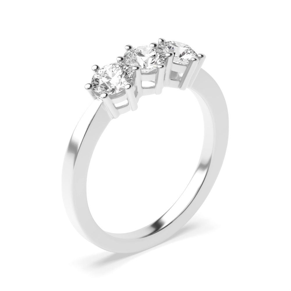 Six Prong Round Diamond Trilogy Engagement Rings in Gold and Platinum