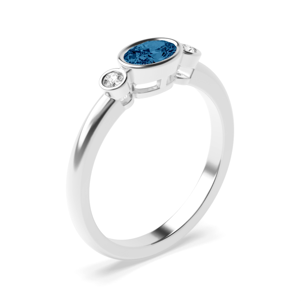 6X4mm Oval Blue Topaz Three Stone Diamond And Gemstone Engagement Ring