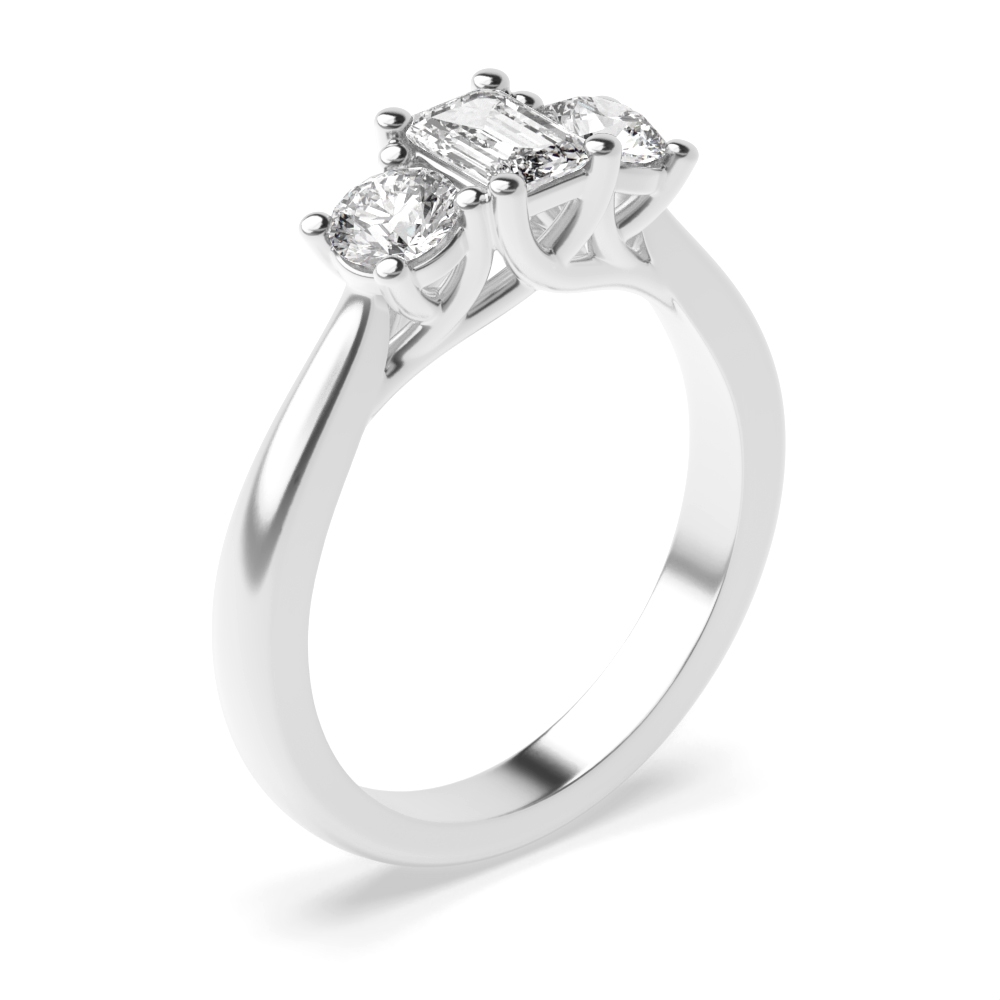 prong setting emerald and round trilogy diamond engagement ring