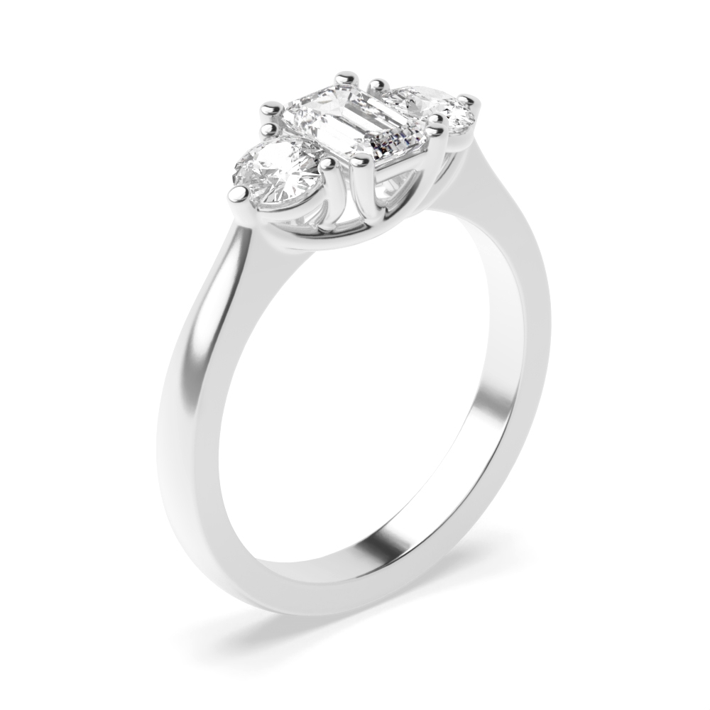 prong setting oval and emerald trilogy diamond engagement ring