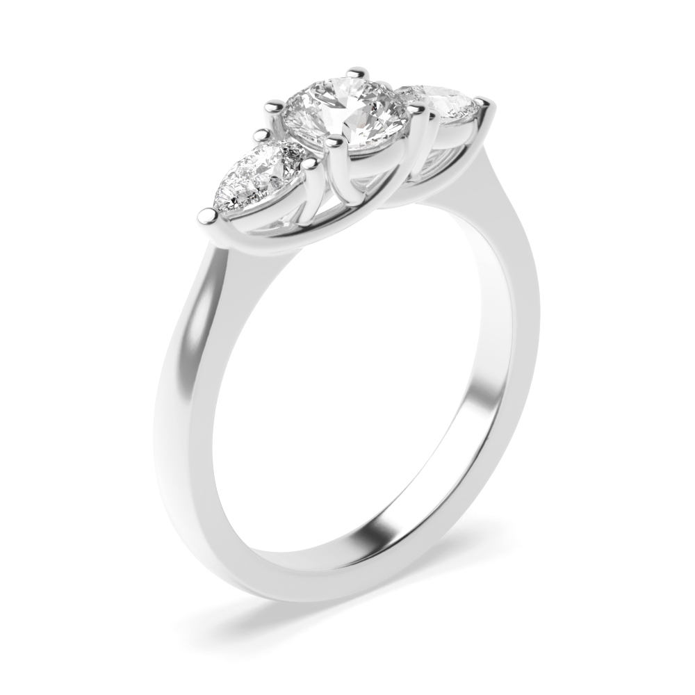 prong setting round and pear trilogy diamond engagement ring